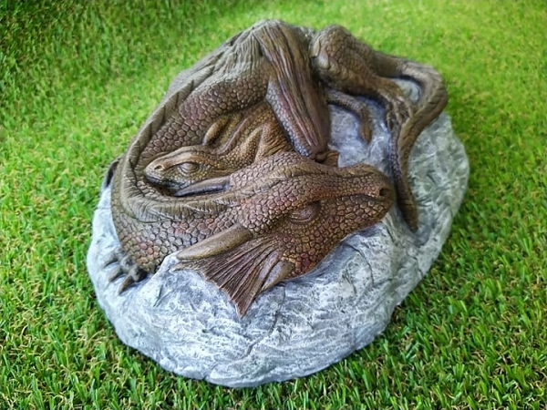 Dragon and her baby sleeping on a rock head view garden ornament